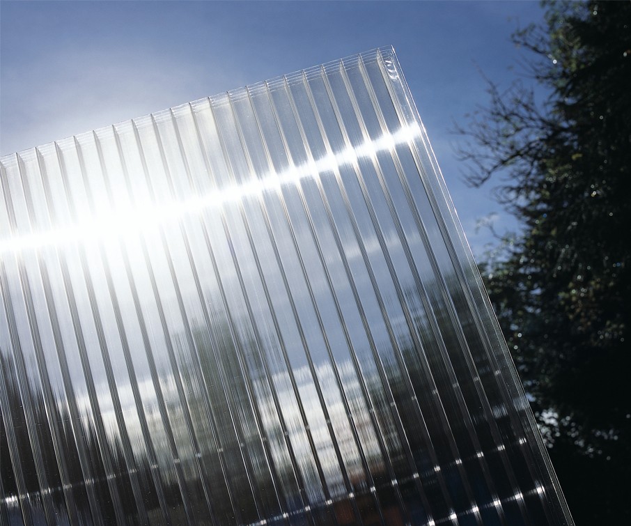 Clear Polycarbonate Sheet held up to the sky to illustrate optical clarity